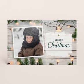 Foto Weihnachtskarte mit Tannenzweig und Lichterkette